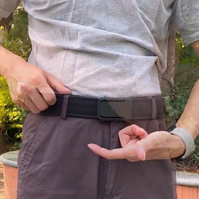 Releasing the belt with the lever under the buckle